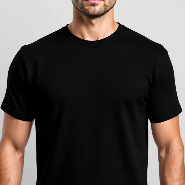 Black tee on a man, grey studio: blank t-shirt mockup